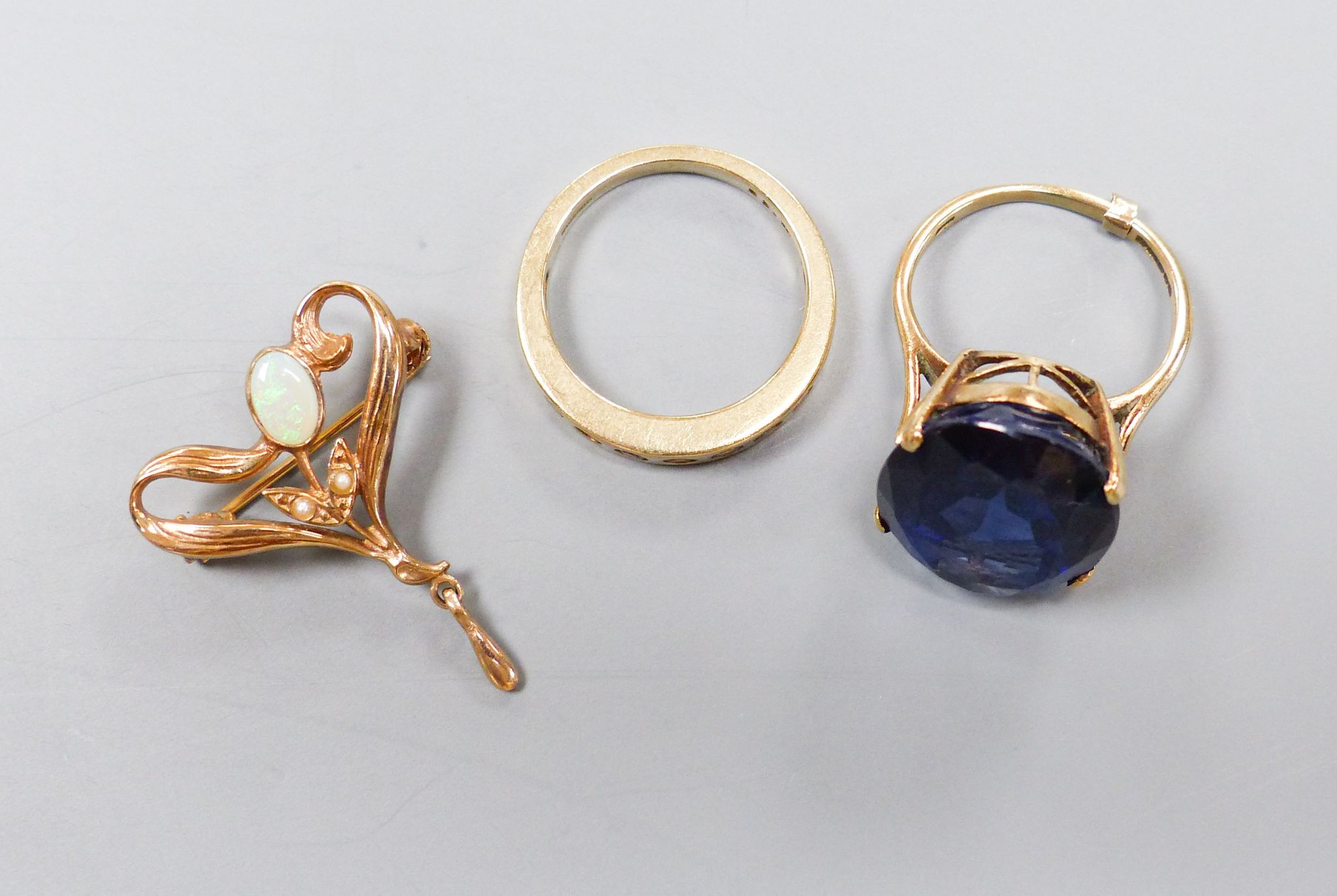 A modern 9ct gold Art Nouveau style gem set pendant and two 9ct and gem set rings, gross 14.2 grams.